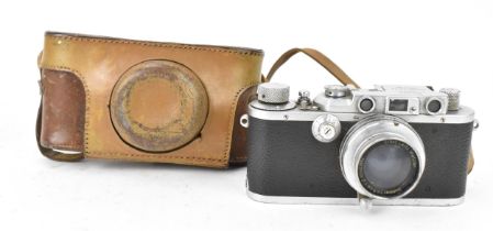 A cased Leica DRP No. 293142 Ernst Leitz Wetzlar Summar 50mm lens, in brown leather case