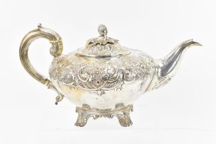 A William IV silver teapot by Richard Pearce & George Burrows, London 1833, designed with embossed