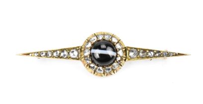 A Victorian yellow metal, diamond and agate brooch, set with central cabochon stripe agate in a halo