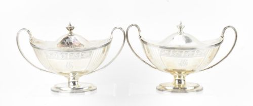 A pair of George III silver lidded sauce boats by John Robins, London 1795, with twin loop handles ,