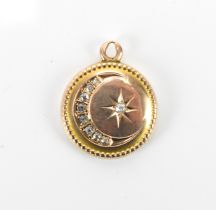 A Victorian/Edwardian yellow metal and diamond inset locket, of circular form with graduated old cut