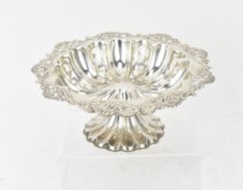 An Edwardian silver sweetmeat pedestal bowl by William Hutton & Sons, Birmingham 1904, with
