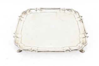A George V silver salver by Mappin & Webb, Sheffield 1930, of square form with moulded pinched