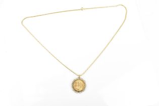 An Edwardian full sovereign with St George 1908, in a 9ct gold pierced pendant mount, on gold plated