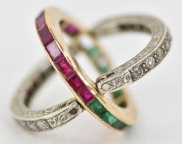 An Art Deco ruby, emerald and diamond swivel or flip eternity ring, the central hoop composed of a