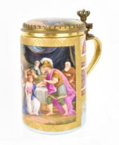 A brass-mounted Royal Vienna porcelain tankard, of cylindrical form painted with a figurative