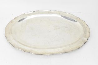 A South American silver platter by Hecho A Mano, Chile, grade 900, of oval form with wave rim, 45 cm