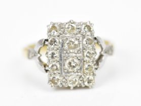 An 18ct gold, platinum and diamond tablet dress ring, of rectangular form set with fourteen