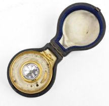 A cased pocket barometer and compass by P.H Stewarde, London, 'Compensated', with brass mount and