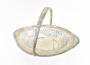 An Edwardian silver basket by A A Haden, Birmingham 1903, of oval form with swing handle, the bowl