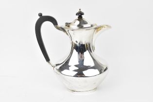 A George VI silver coffee pot by Barker Brothers Silver Ltd, Birmingham 1940, of baluster form