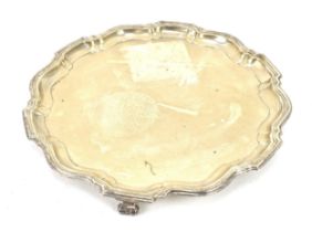 A George VI silver salver by Barker Brothers Silver Ltd, Birmingham 1936, with moulded rim, on three