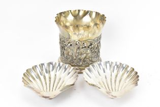 A Victorian silver wine bottle holder by Goldsmiths & Silversmiths Co, London 1894, with pierced