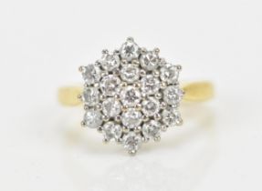 An 18ct yellow gold and diamond snowflake dress ring, set with nineteen brilliant cut diamonds,