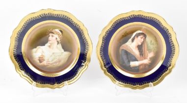 A pair of early 20th century painted porcelain plates by Oscar and Edgar Gutherz, Royal Austria,