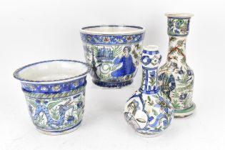A small collection of 19th century Persian Qajar glazed pottery, to include two cachepots, a
