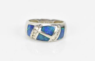 A 14 ct white gold, diamond and black opal ring, of modernist design inset with polished opal and
