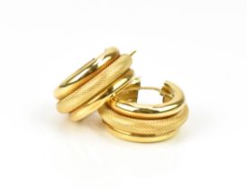 A pair of Italian 18ct yellow gold hoop earrings, with textured central tube, hallmarked to the
