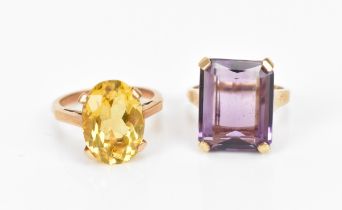 Two dress rings, to include a 9ct gold and citrine ring set with an oval cut stone in four claw