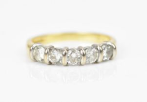 An 18ct yellow gold five stone diamond ring, set with five tension set brilliant cut same-sized