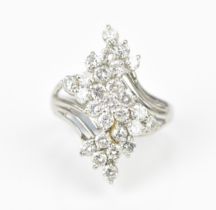 A platinum and diamond dress ring, set with twenty-seven same-sized brilliant cut diamonds in a
