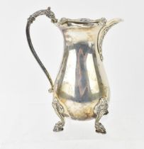 A George VI silver cream jug by Reid & Sons Ltd, Birmingham 1939, of baluster form with Celtic