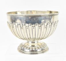 A George V silver footed bowl by Mappin and Webb, Sheffield 1918, of circular form with fluted body,