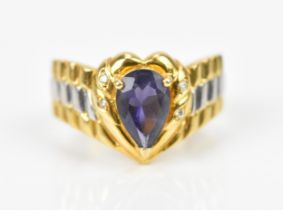 A yellow metal, platinum, diamond and iolite dress ring, with heart shaped central mount to the pear