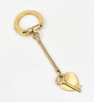A 14 carat yellow gold key ring by Tiffany & Co, with key and heart charm, weight 6.4 grams
