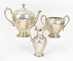 A Victorian silver three piece tea set by John, Edward, Walter & John Barnard, London 1876,