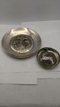A Cypriot silver dish with embossed ornament and another decorated with a rim 145g Location: