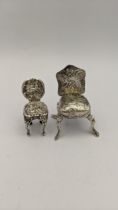 Two silver miniature chairs having embossed design, 24.1g, Location: