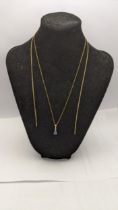 A 9ct gold necklace A/f and a 9ct gold necklace with a diamond and sapphire coloured stone 4.1g