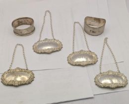 Silver to include four decanter labels and two napkin rings, total weight 80.2g Location: