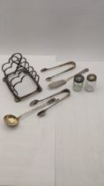 Mixed silver and white metal to include a silver Birmingham 1896 toast rack together with two silver