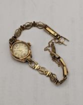 A 9ct gold ladies manual wind wristwatch on a 9ct gold bracelet A/F, total weight 8.2g Location: