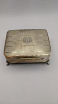 Birmingham 1936 silver four footed dressing table box having a machine turned lid and a navy blue