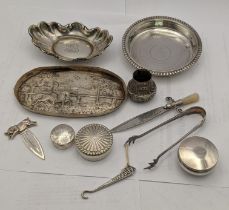 Silver to include a coaster, a dish, a Victorian dish, two pill boxes, a page marker, a glove button