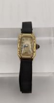 A 18ct gold ladies Art Deco manual wind wrist watch on a fabric strap Location: