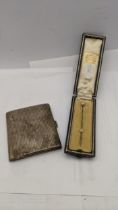 A silver cigarette case together with a white metal stick pin 97.1g Location: