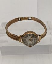 A 9ct 20th century ladies 9ct gold manual wind wrist watch on a 9ct gold bracelet total weight 16g