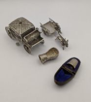 Mixed silver and white metal to include a miniature pierced carriage, a carriage donkey and man,