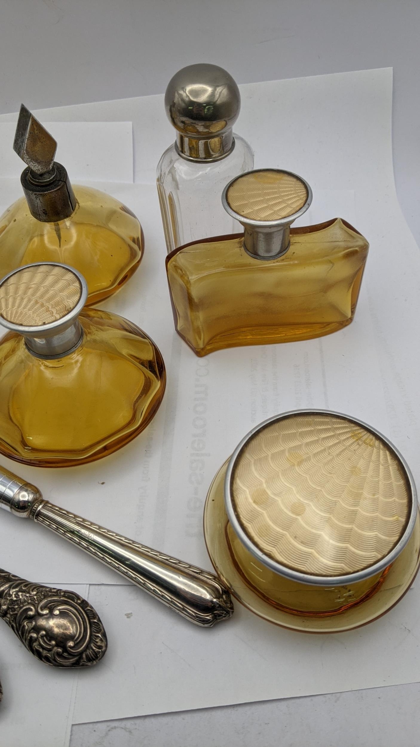 Dressing table items to include brown glass bottles with engine turned lids, silver handled manicure - Image 4 of 4