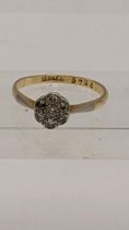 Am 18ct and platinum daisy ring set with diamonds 1.8g Location: