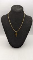 A 9ct gold cross pendant on a 9ct gold box link necklace, total weight 9.4g Location: