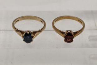 Two 9ct gold rings one set with a blue sapphire and the other a red garnet, total weight 4.5g