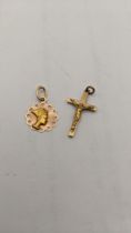 A 14ct gold pendant 0.9g, together with a 9ct gold crucifix pendant 1.5g Location: