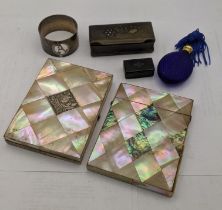 A mixed lot to include two mother of pearl card cases together with a silver napkin ring, along with
