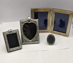 Silver photograph frames to include a double frame two modern embossed frames and a small oval