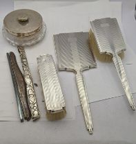 Birmingham 1954 silver dressing table items to include a Mirror, hair brush and one other along with